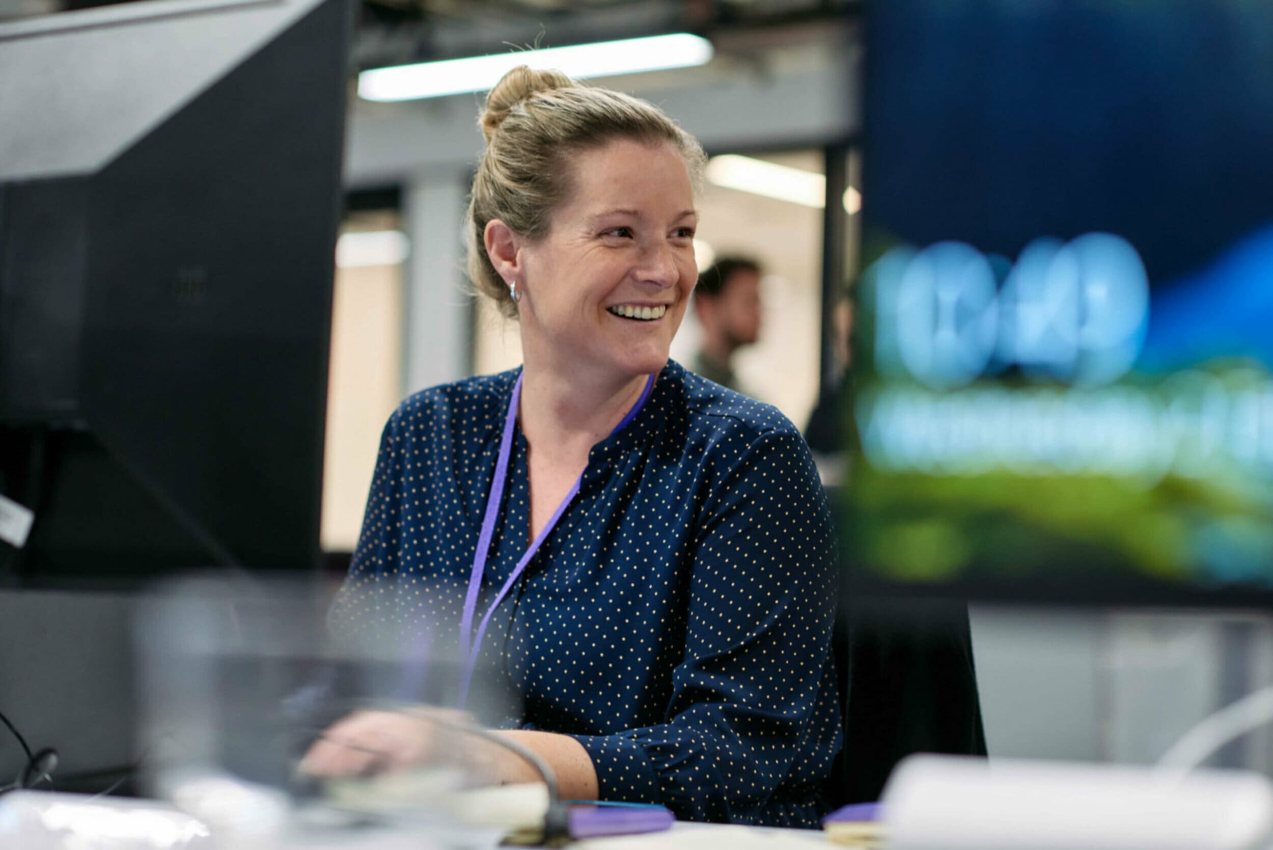 Woman working at desk smiling