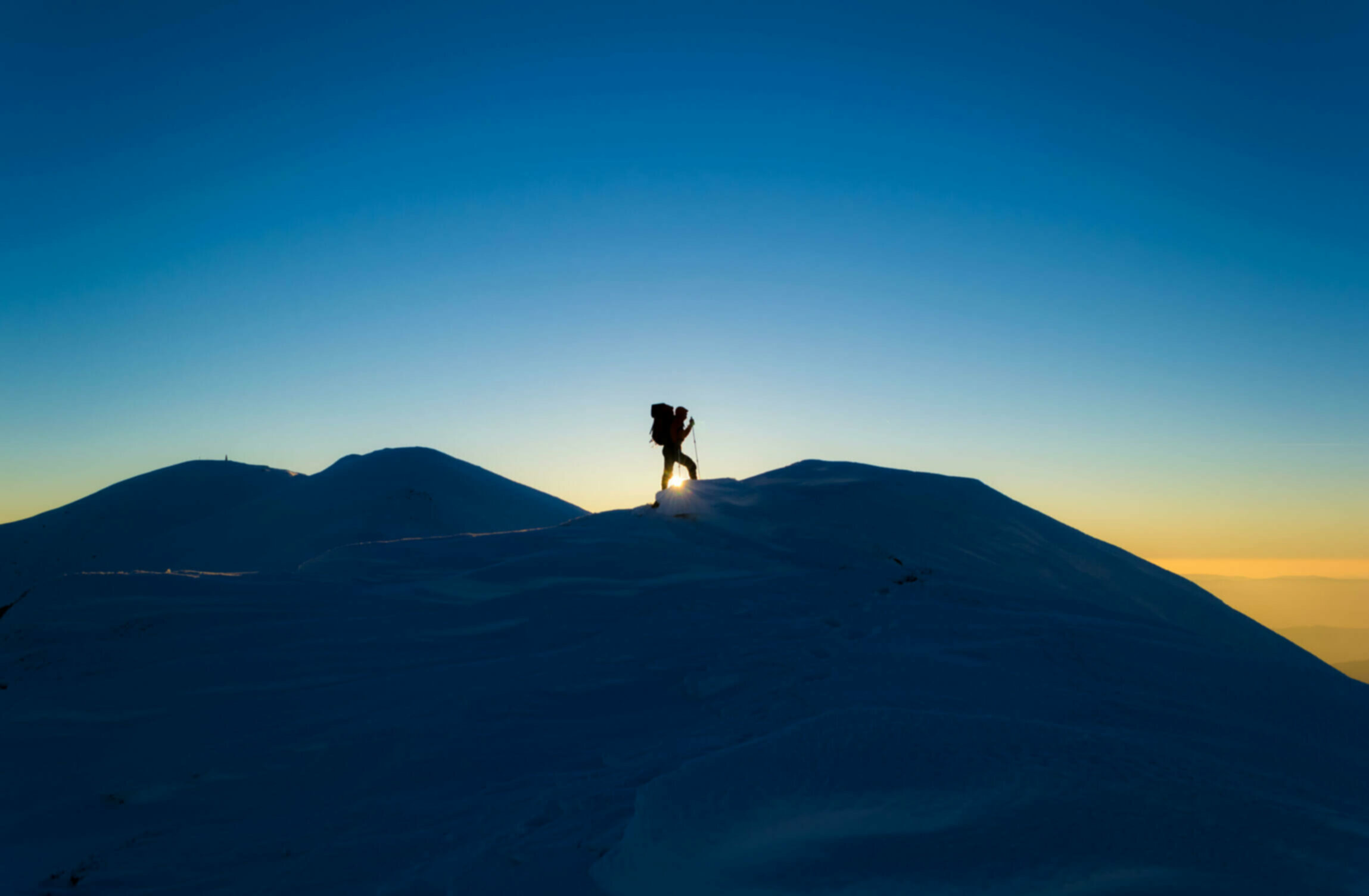 Man hiking on a snowy mountain