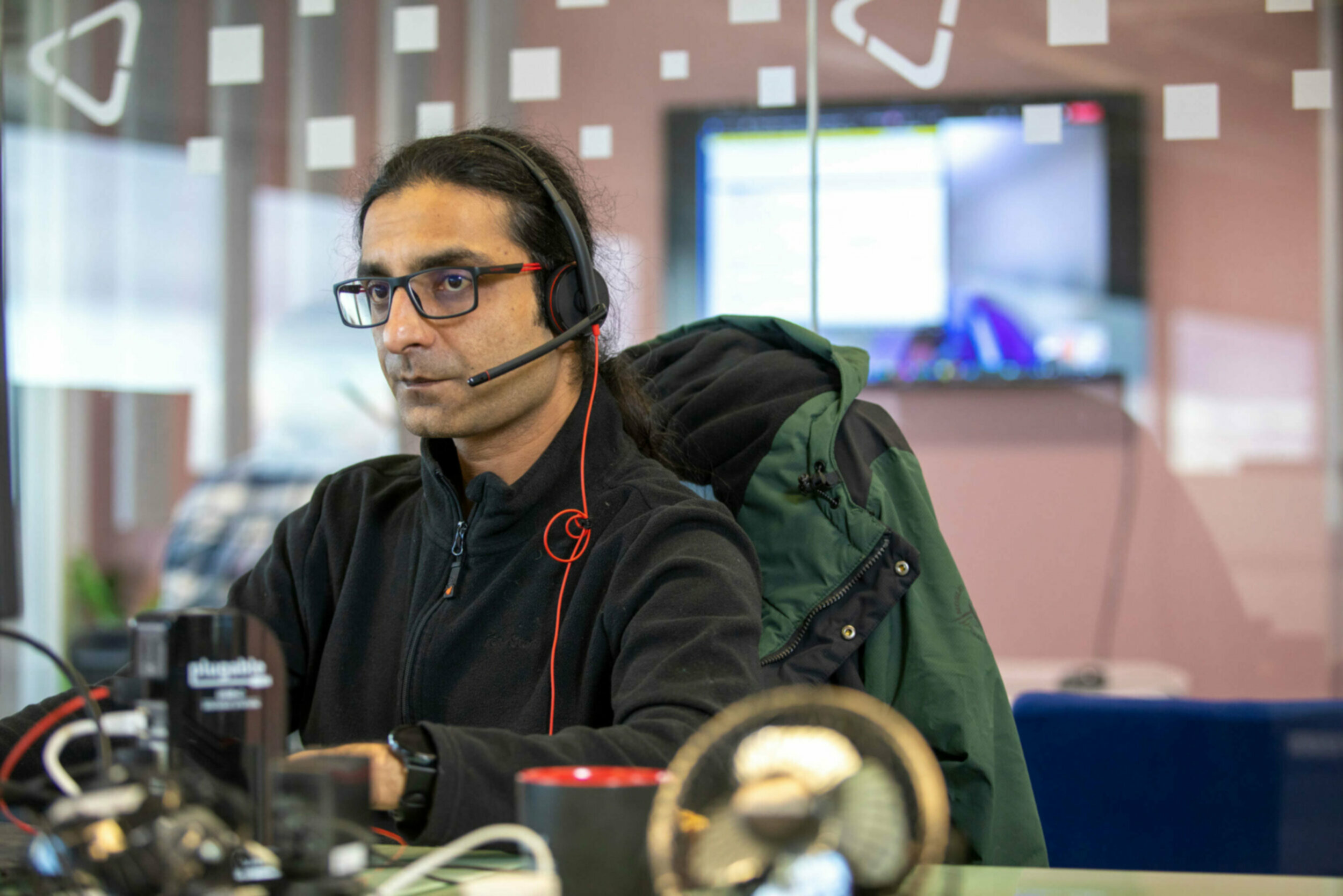 Man with headset at computer
