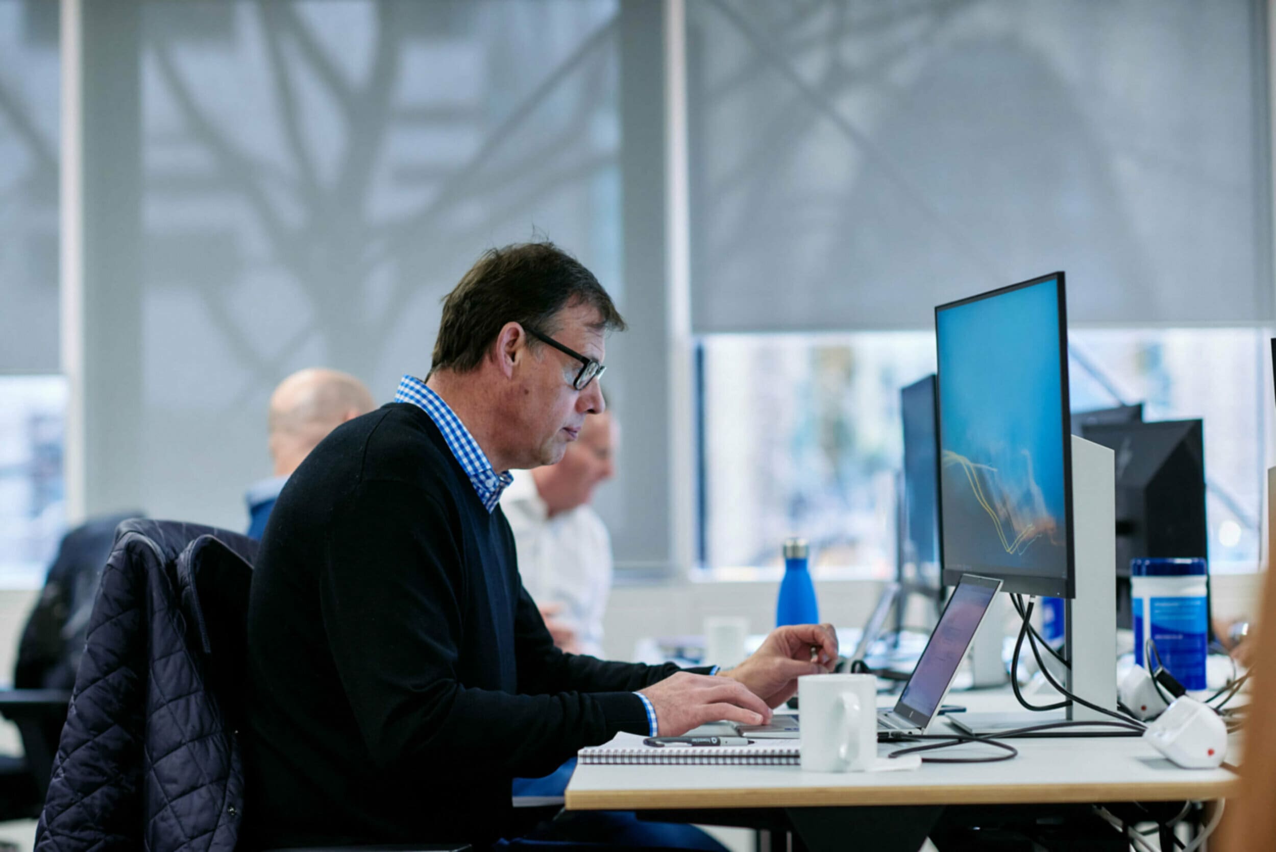 Man sitting at computer desk working in the office