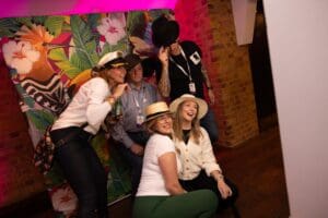 A group of people posing with props