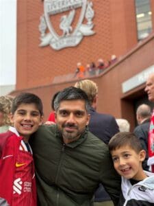 Man posing with his sons